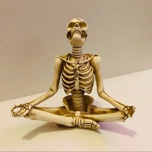 Yoga meditating skeleton figure